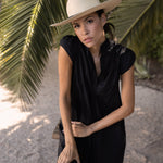 Ninakuru long brim Panama hat with leather band and brass eyelets.