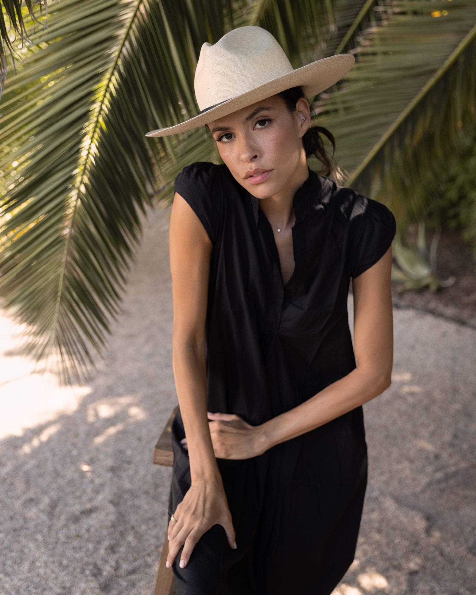 Ninakuru long brim Panama hat with leather band and brass eyelets.