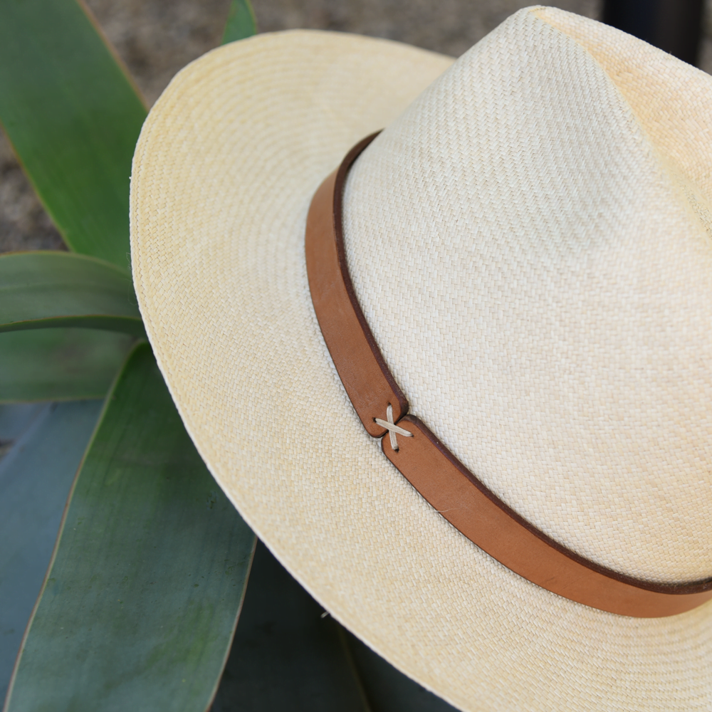 Ninakuru long brim Panama hat with leather band and X stitch. Cotton interior band.