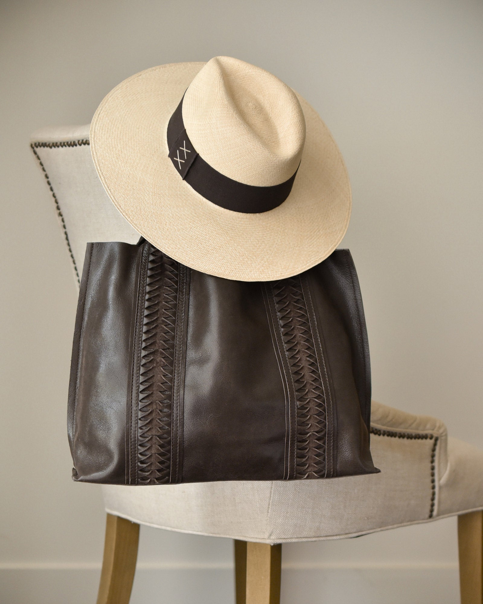 Ninakuru Panama hat and leather bag.