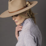 Ninakuru long brim wool hat with leather band and horsehair tassels.