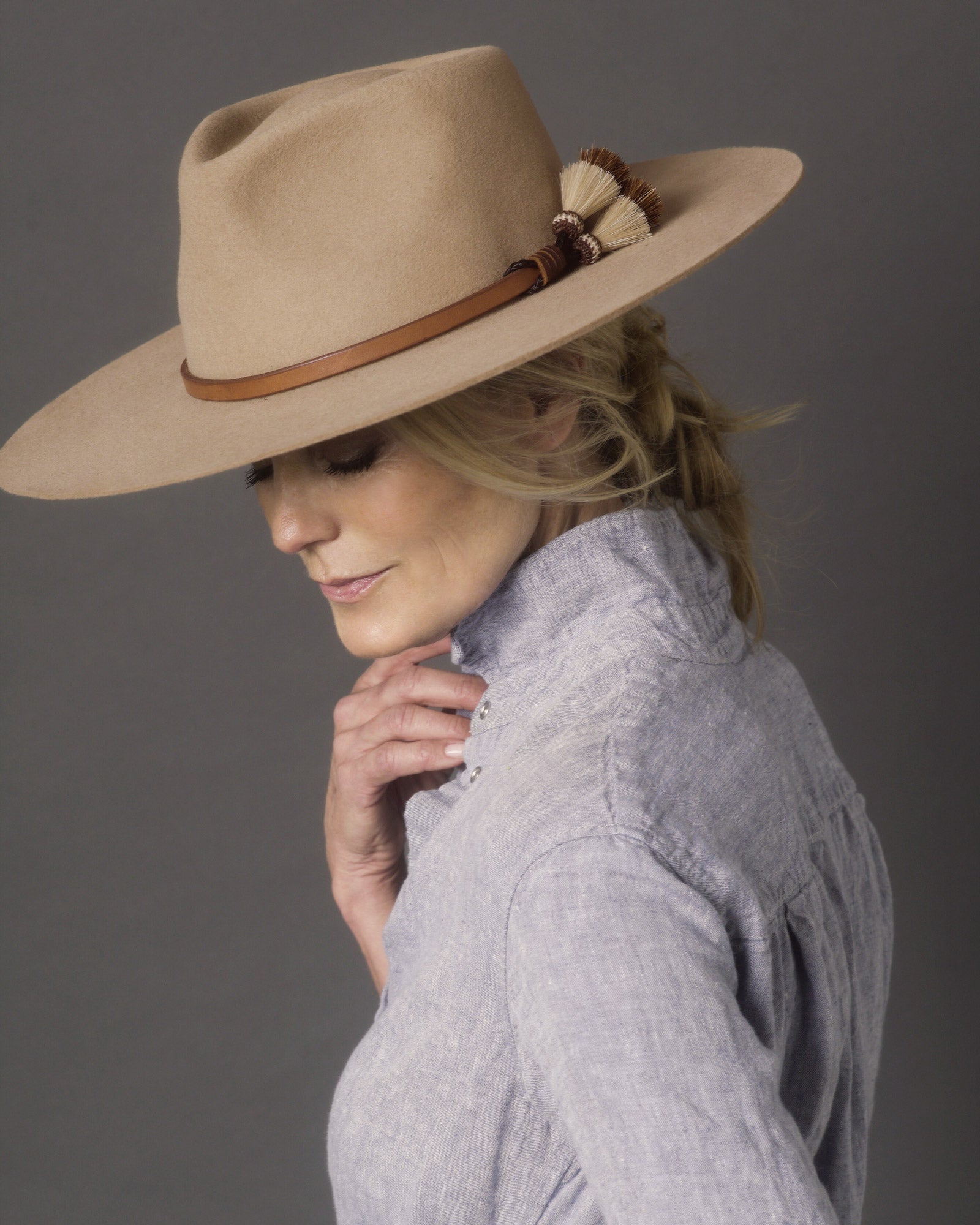 Ninakuru long brim wool hat with leather band and horsehair tassels.