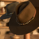Ninakuru long brim wool hat with leather band, turquoise nuggets. Leather interior band.
