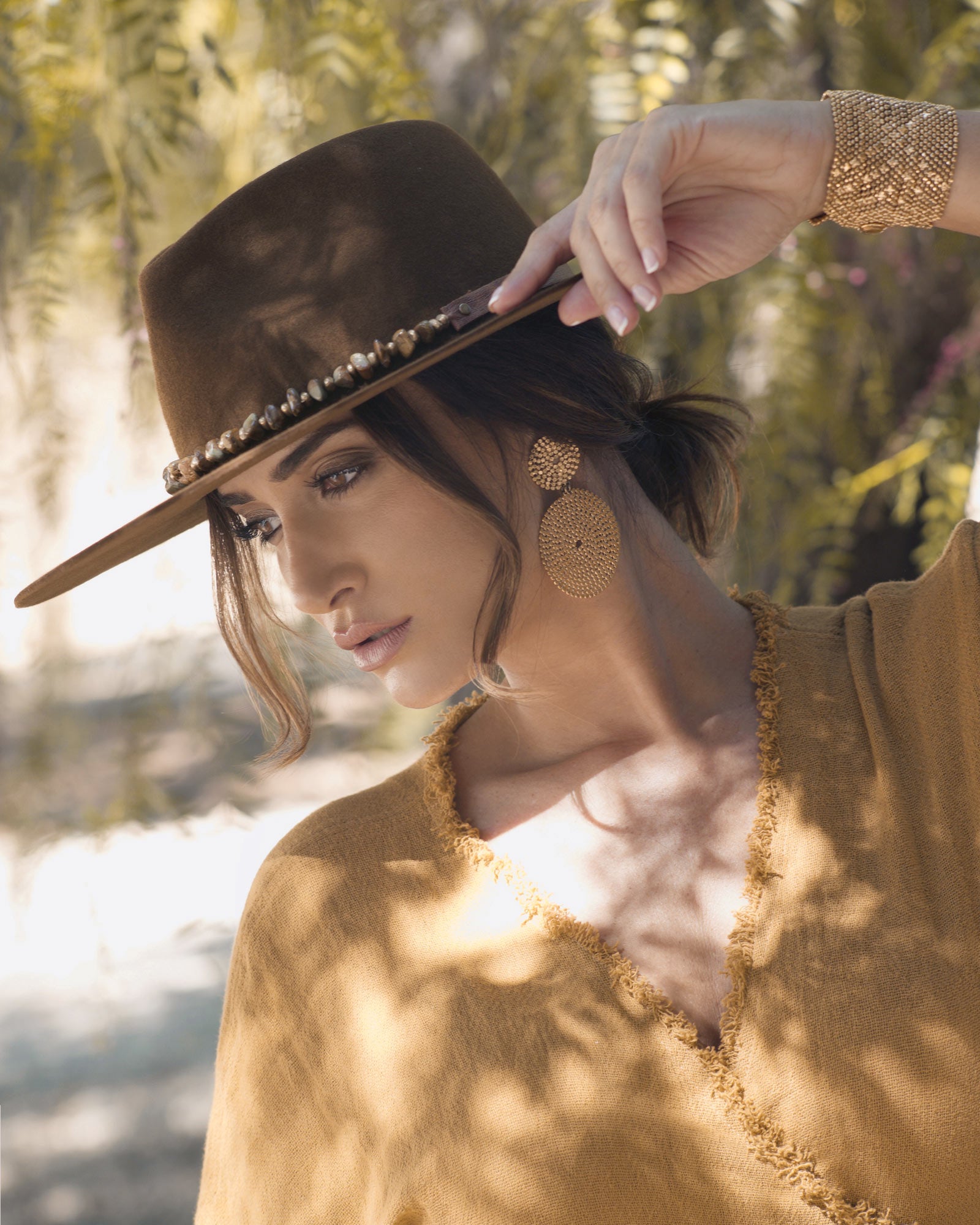 Ninakuru long brim wool hat with leather band, turquoise nuggets. Leather interior band.