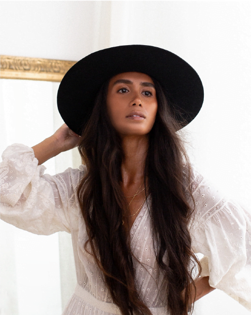 Ninakuru long brim wool hat with black leather band and eyelets. Leather interior band.