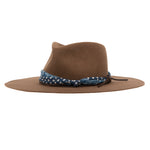 Ninakuru wool hat with cotton wrap band and leather lace.