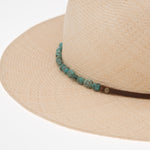 Ninakuru Panama hat with turquoise nuggets and leather band.
