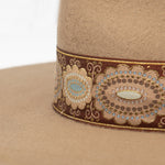 Ninakuru wool hat with vintage brocade ribbon.
