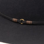 Ninakuru long brim wool hat with leather band and bronze eyelet.