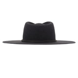 Ninakuru long brim wool hat with leather band and bronze eyelet.