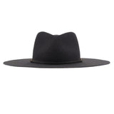 Ninakuru long brim wool hat with leather band and bronze eyelet.