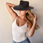 Ninakuru long brim wool hat with leather band and bronze eyelet.