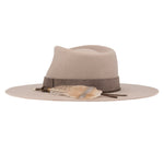 Ninakuru wool hat with leather band, feather and bronze.
