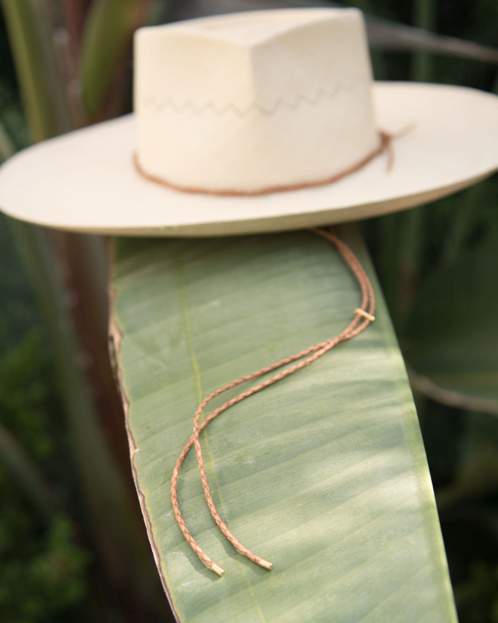 Ninakuru Panama hat with leather braided band and stampede strap.