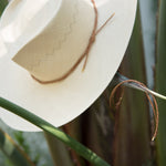 Ninakuru Panama hat with leather braided band and stampede strap.