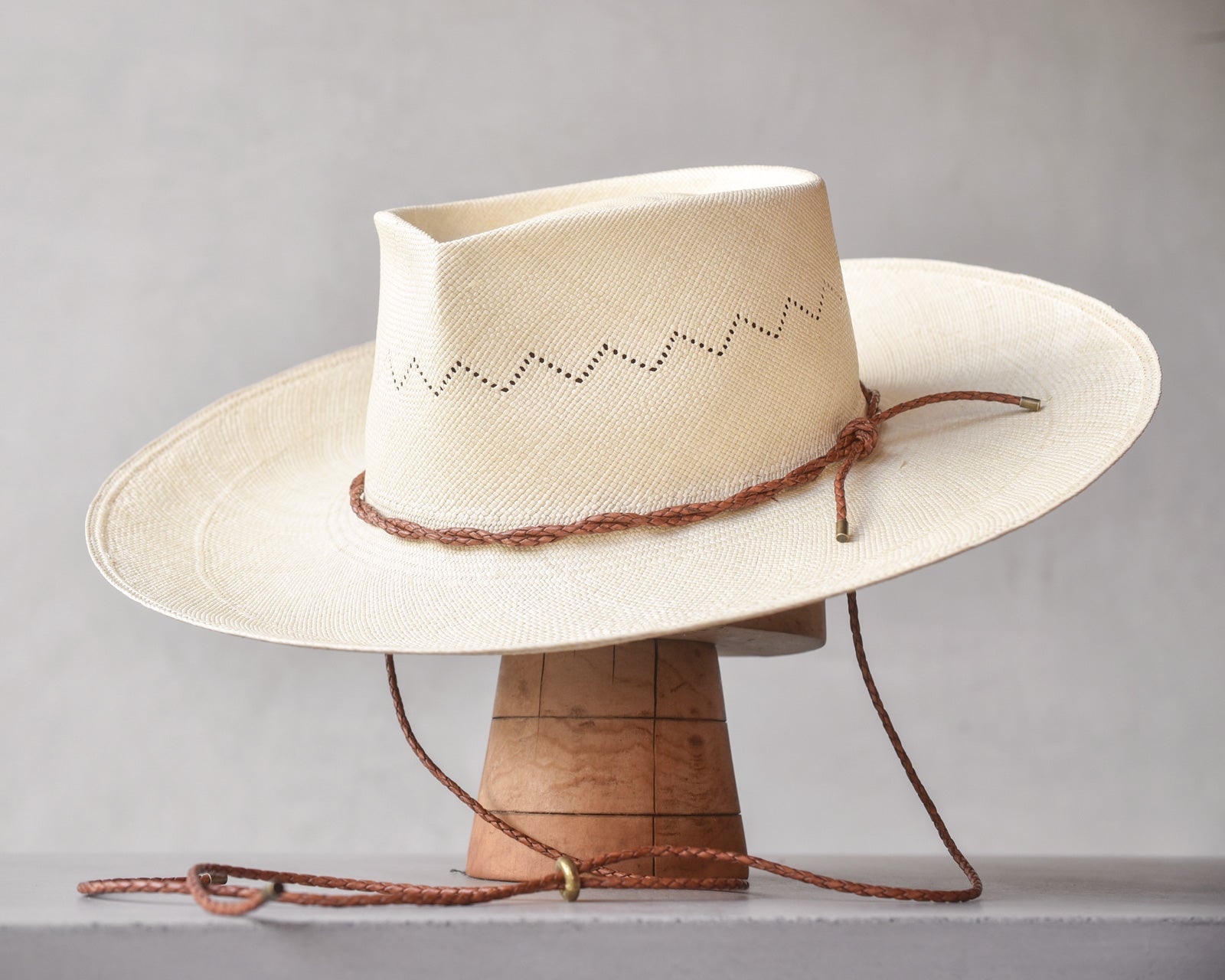 Ninakuru Panama hat with leather braided band and stampede strap.