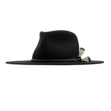 Ninakuru long brim wool hat with leather band and horsehair tassels.