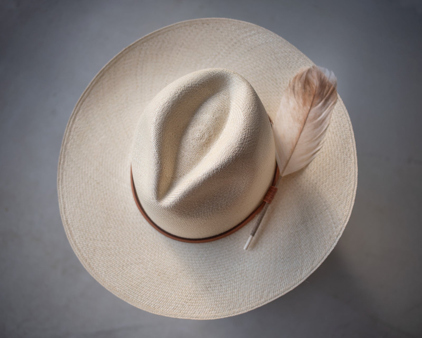 Ninakuru Panama hat with leather band and game feather.