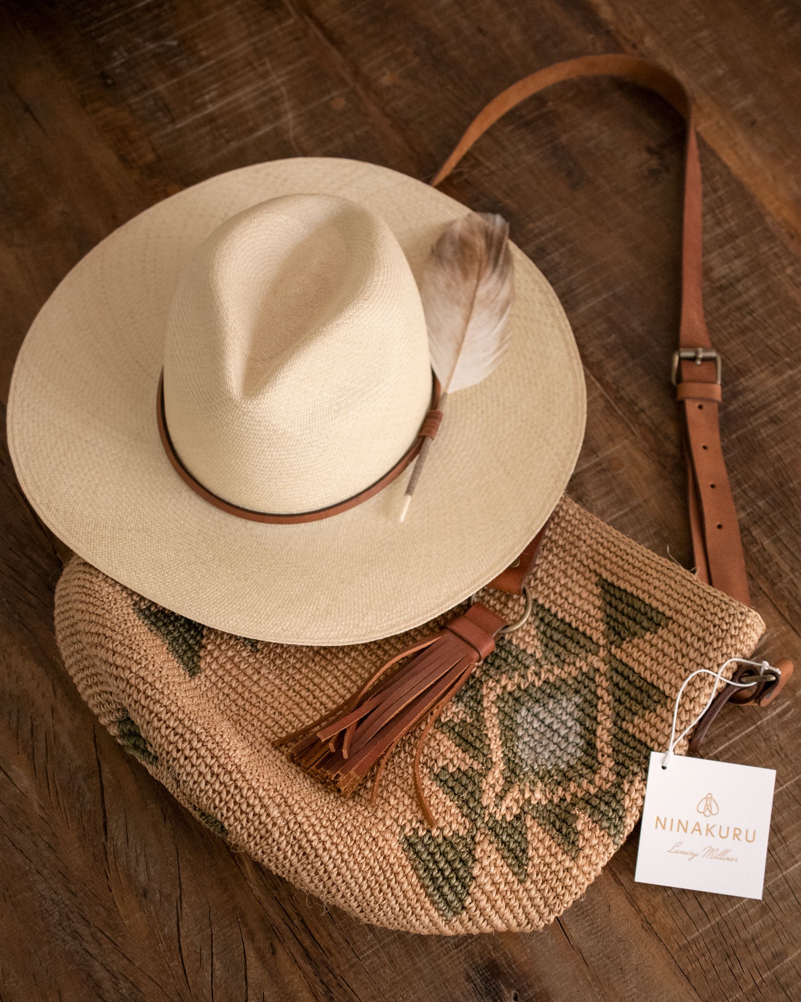 Ninakuru Panama hat with leather band and game feather.