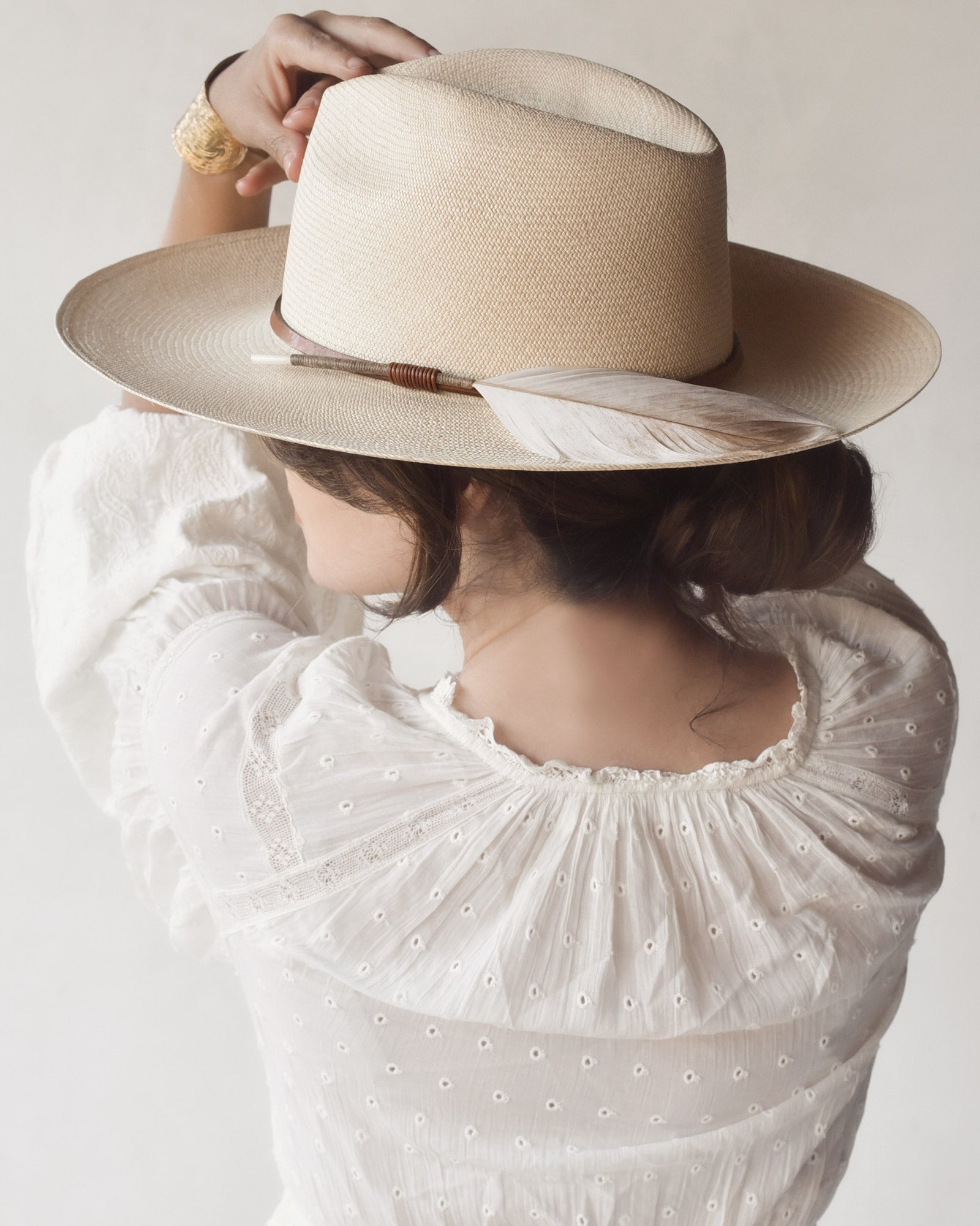 Ninakuru Panama hat with leather band and game feather.