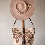 Ninakuru Panama hat with leather and horsehair, paired with agave straw bag.