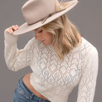Ninakuru wool hat with leather and feather.