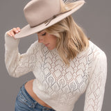 Ninakuru wool hat with leather and feather.