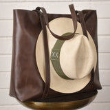Leather tote bag with hat carrier.