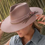 Ninakuru wool felt hat with leather, velvet and rose.