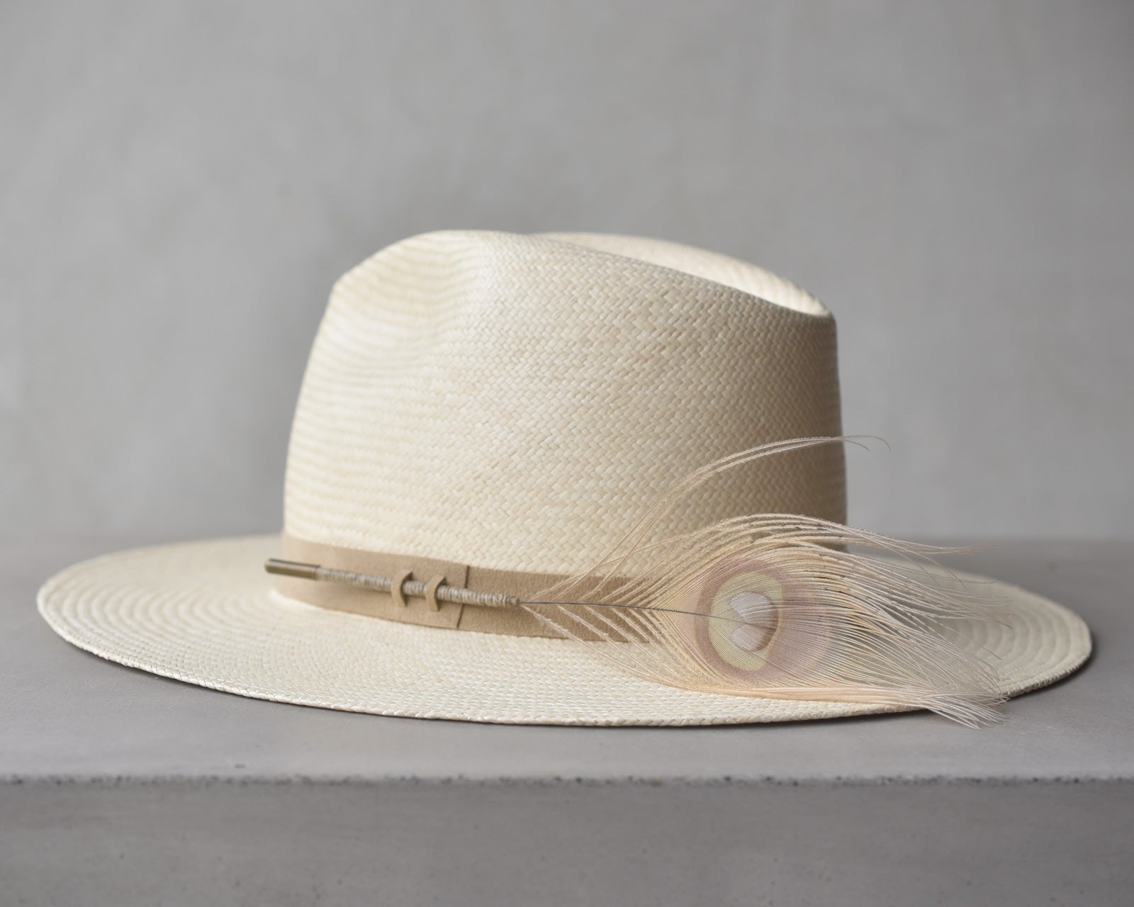 Ninakuru Panama hat with vegan band and peacock feather.