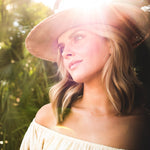 Woman wearing a Ninakuru dyed Panama hat with vegan band.