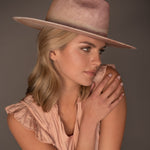 Woman wearing a Ninakuru dyed Panama hat with vegan band.