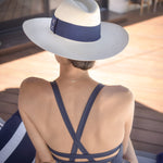 Woman wearing Ninakuru straw hat.