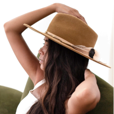 Ninakuru long brim wool hat with suede lace and feather. Leather interior band.